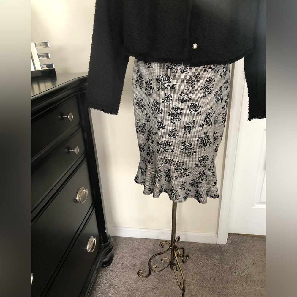 Black and white fitted skirt with ruffle flare at the bottom